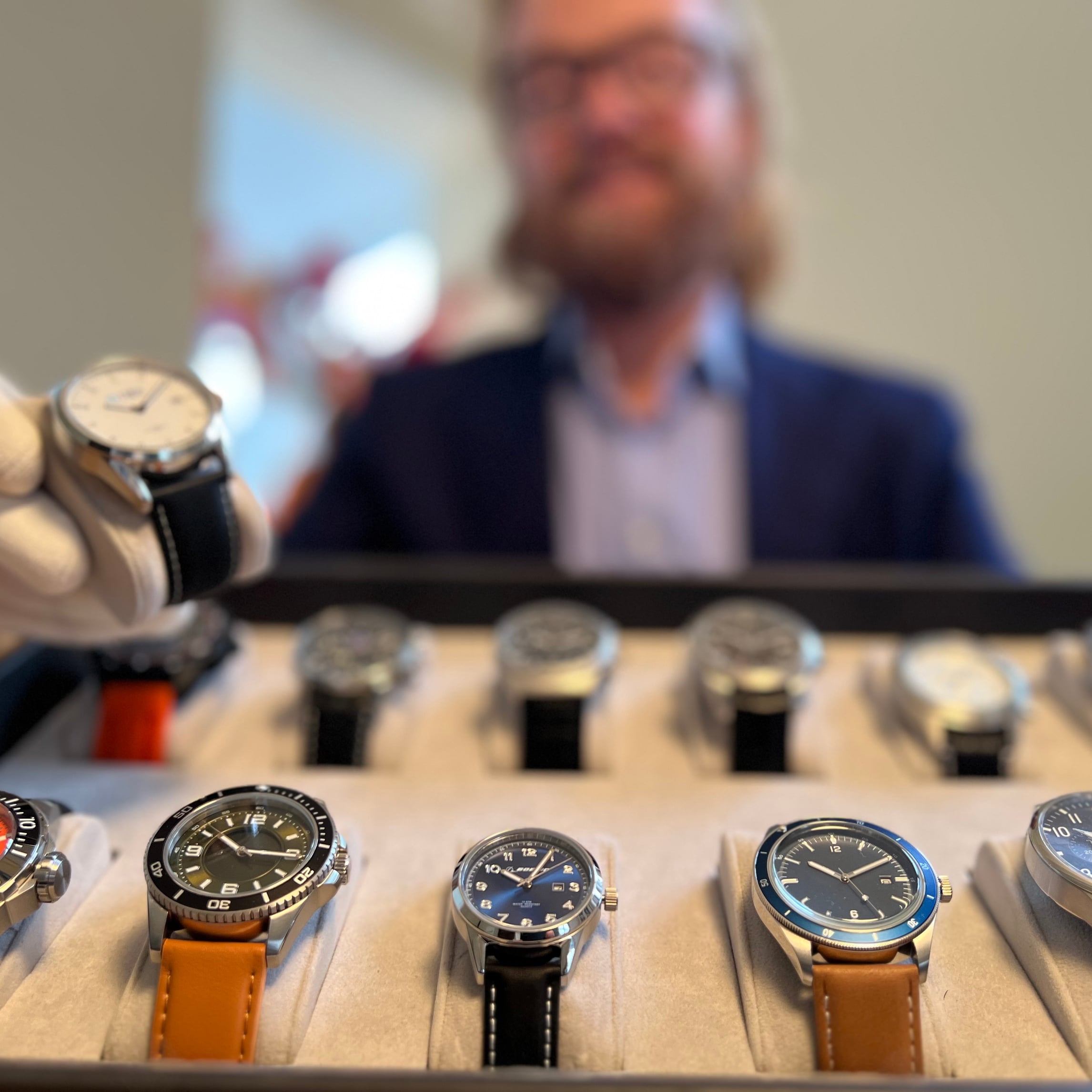 Custom, private label, and promotional watches displayed on a watch tray by Watch Branding, showcasing high-quality and tailored designs.