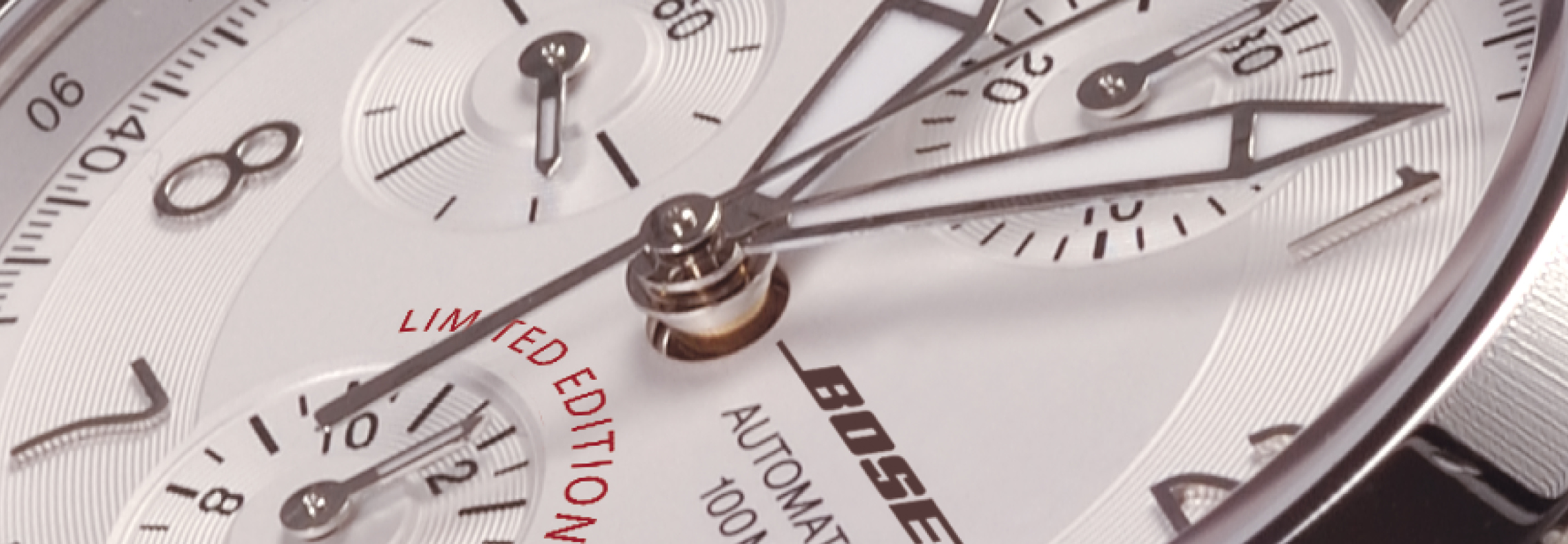 Close-up of a finished custom logo watch with printed logo, showing dial details and case finishing.